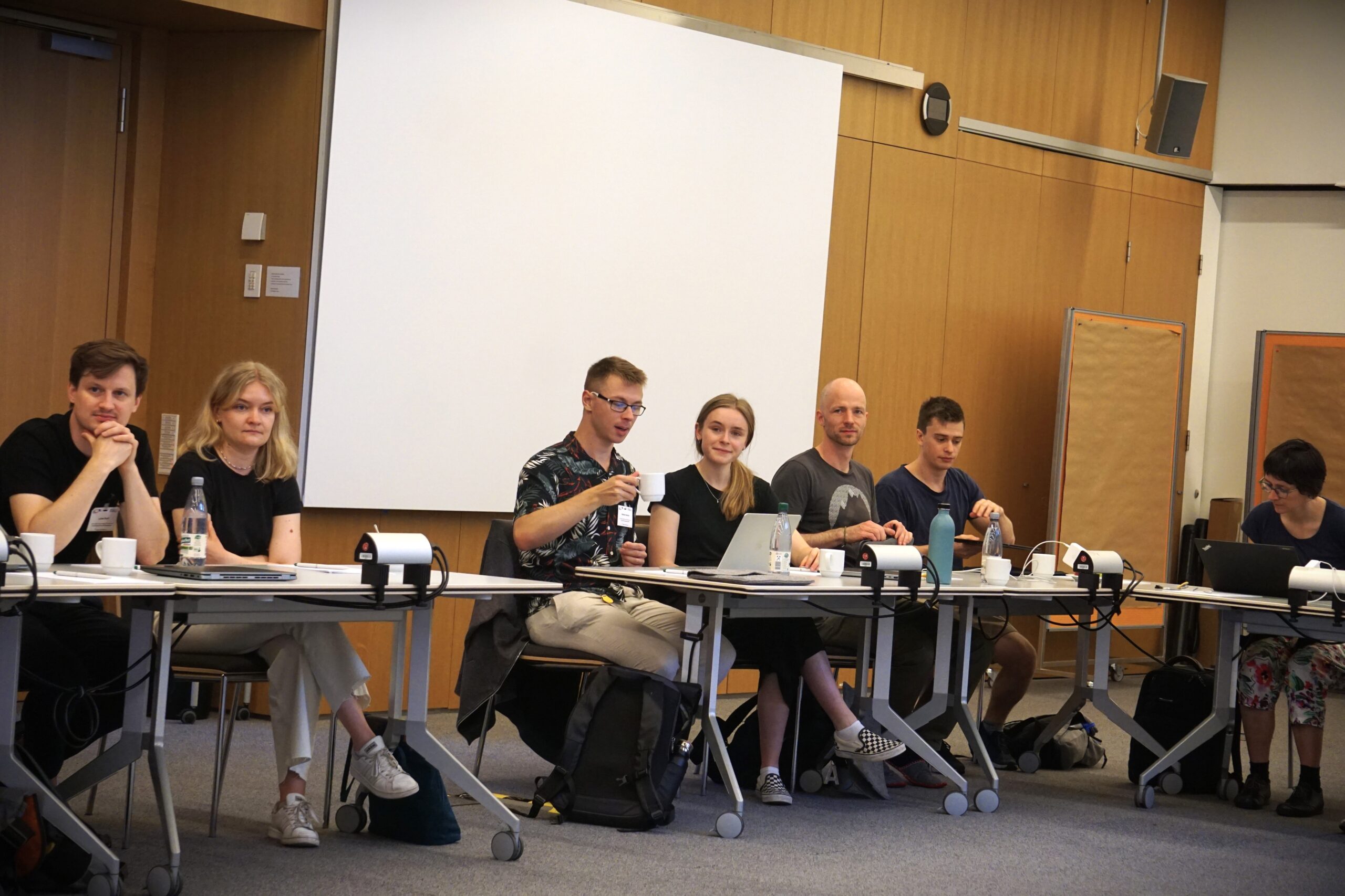 Young SyMoCADS researchers (two women and three men) at the retreat