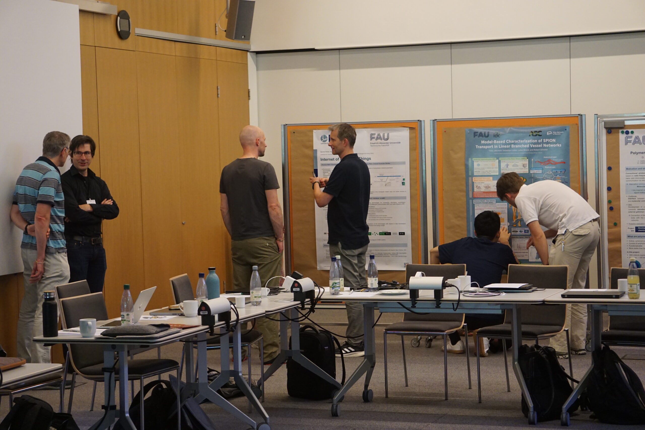 Poeple discussing during the poster presentation