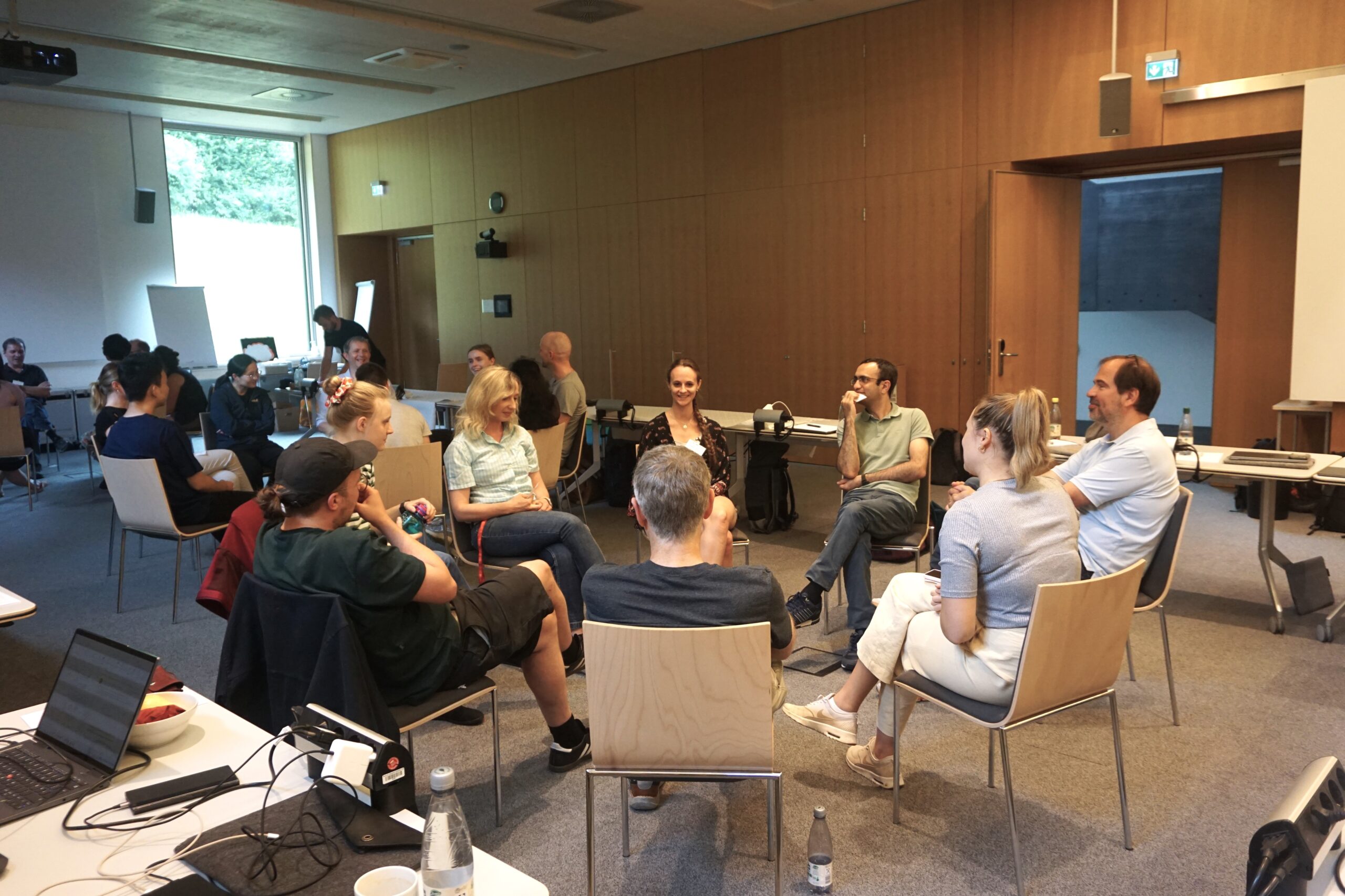 Team building - a group of people sitting in a circle