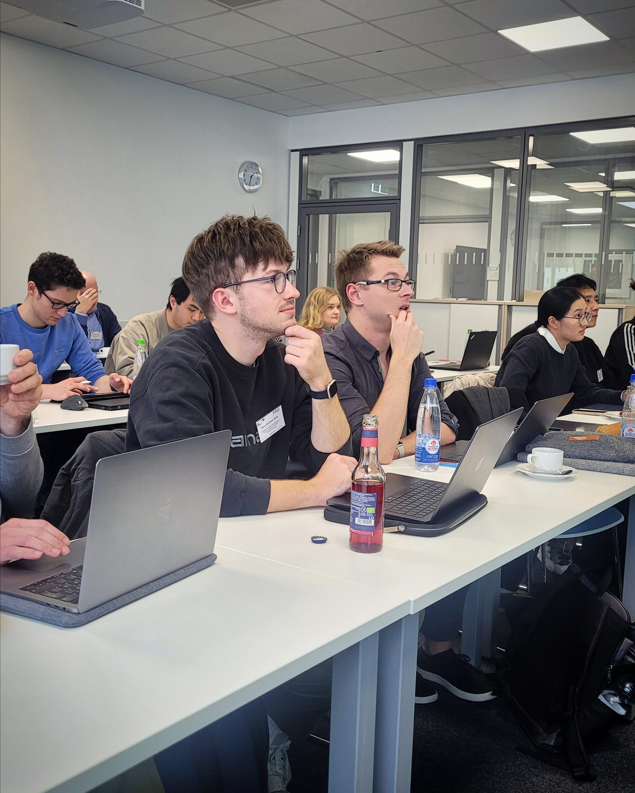 Tomo Jakumeit and Bastian Heinlein listening to presentations