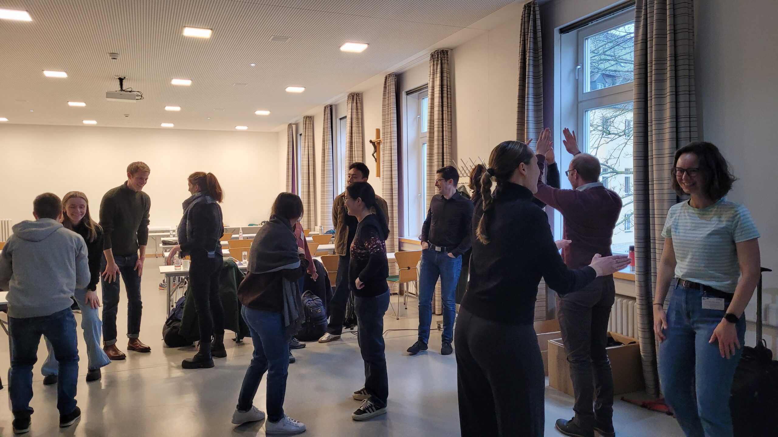 A group of people during “Super Mega High Five” game