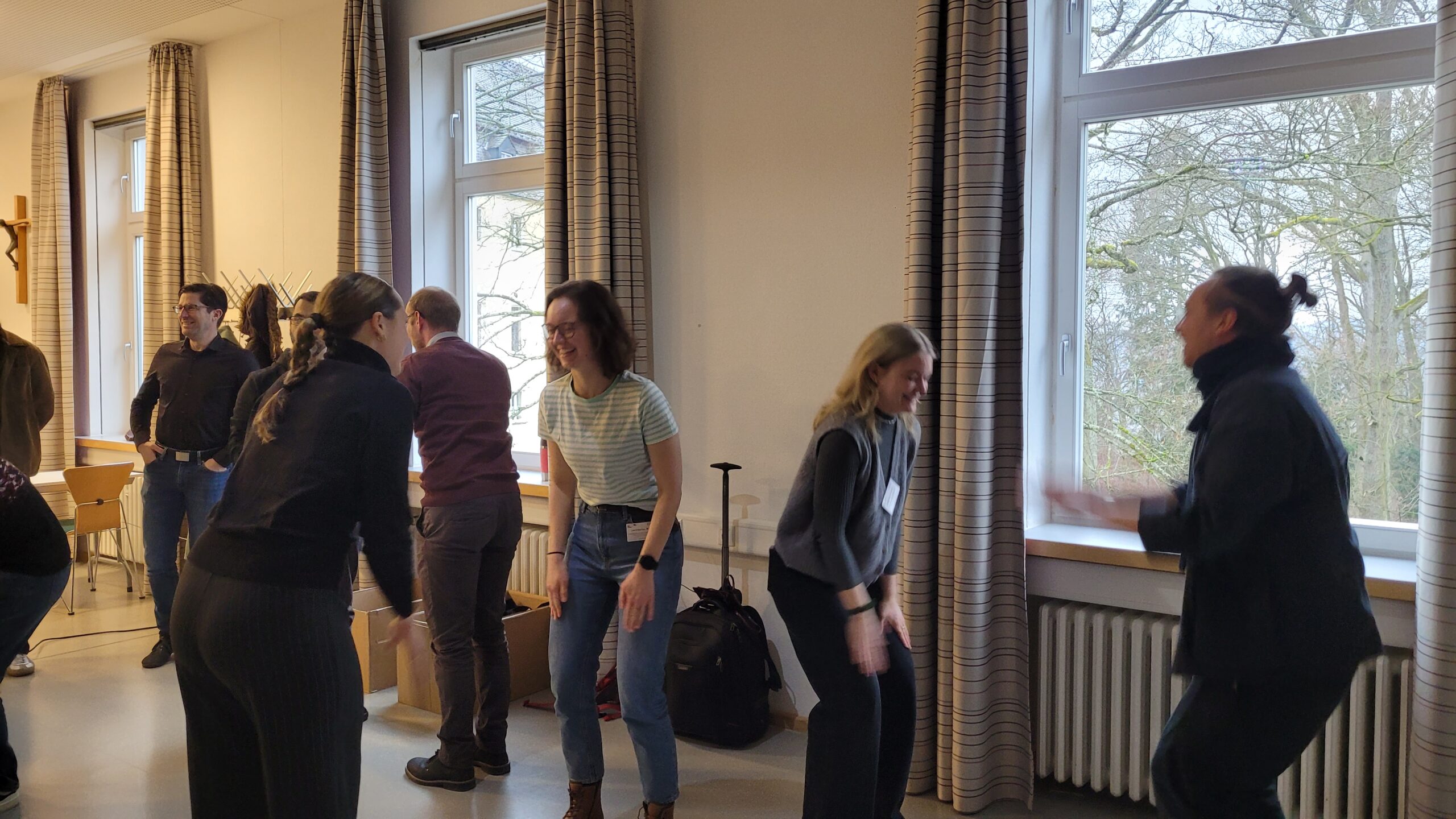 A group of people during “Super Mega High Five” game