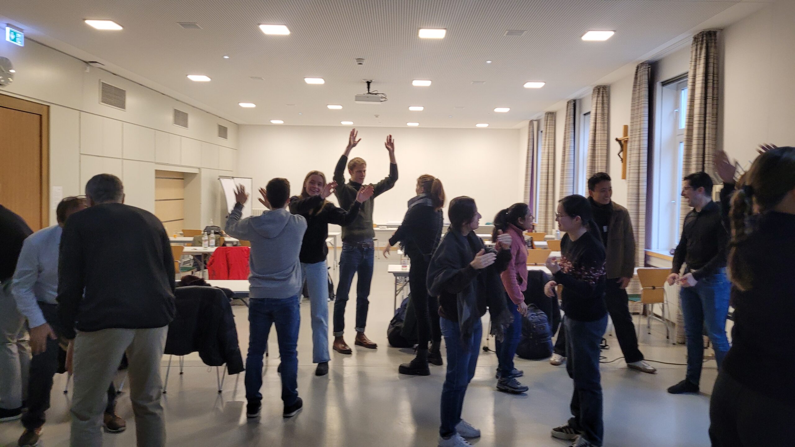 A group of people during “Super Mega High Five” game