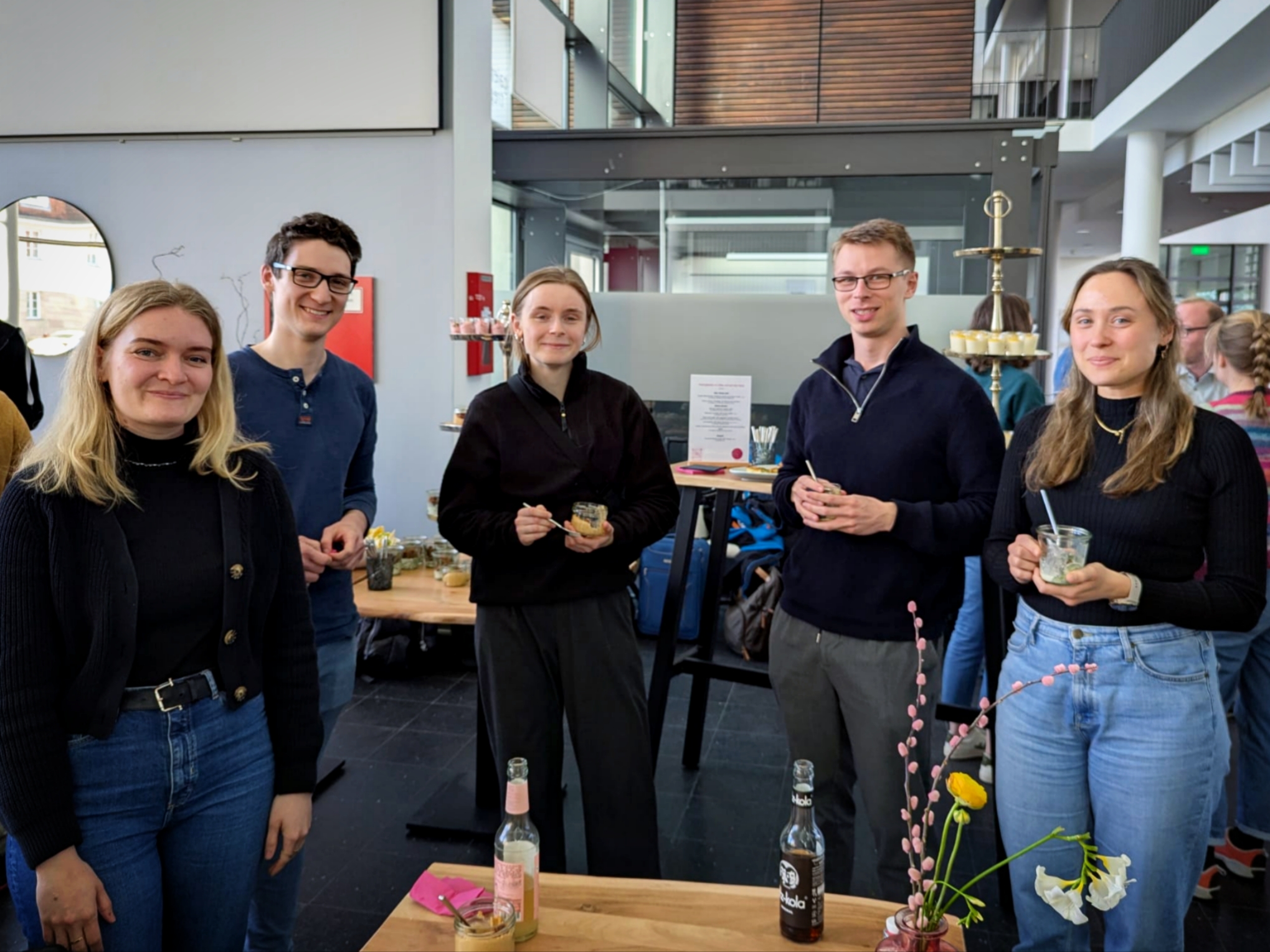 Networking - three female and two male doctoral researchers