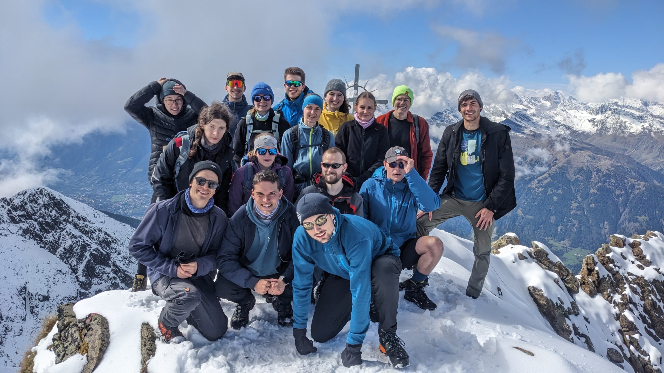 A group of people on the peak of the Hirzer