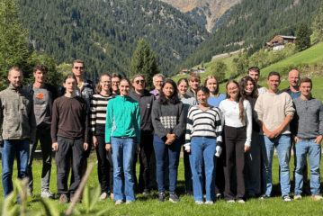 A picture of participants of the course with mountains in the background