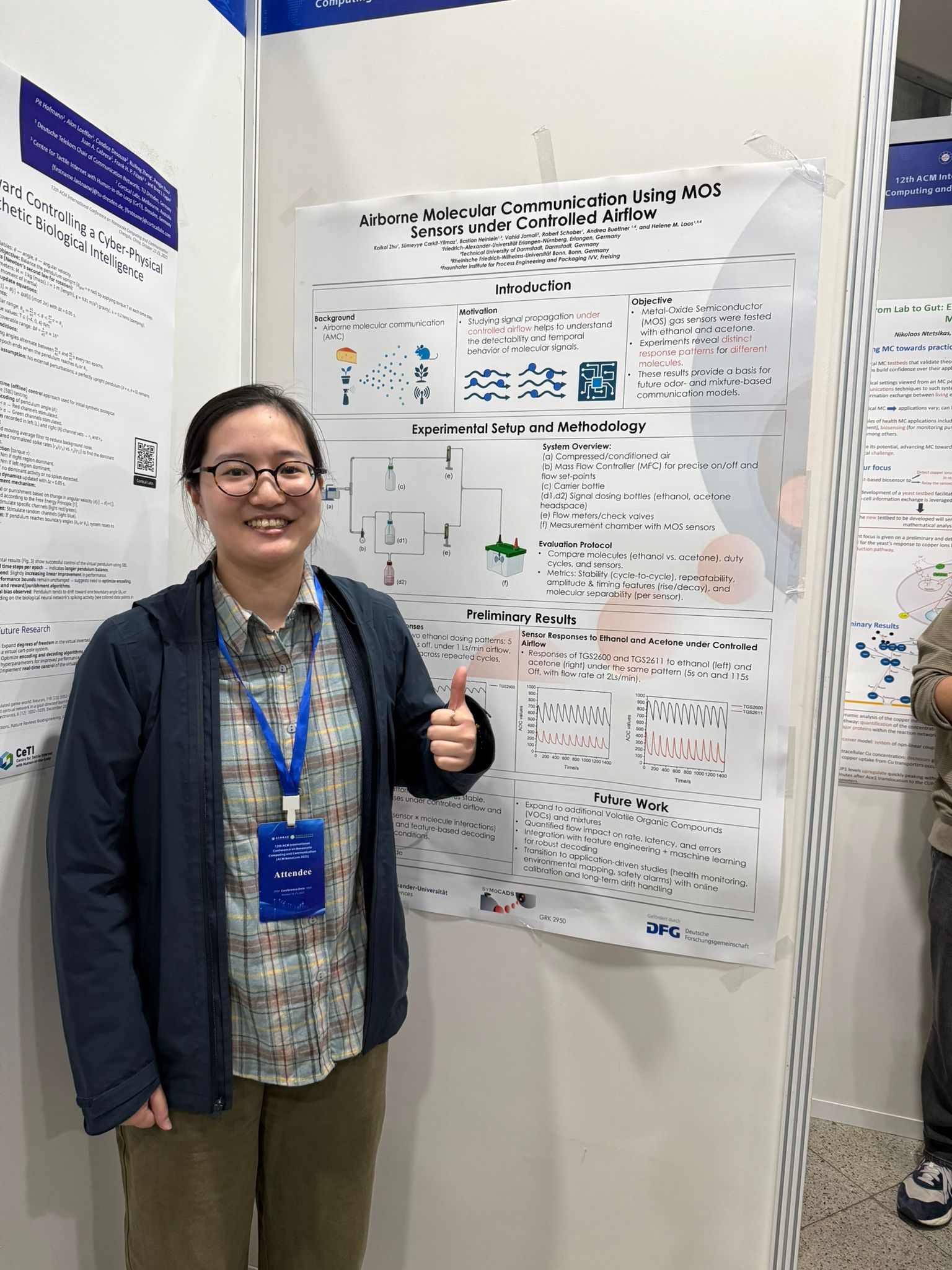 Kaikai (female) with her poster at the NanoCom