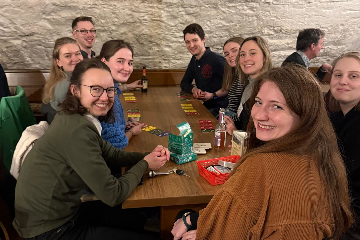 Doctoral students - two male and seven females socializing in the evening of the first day of the workshop