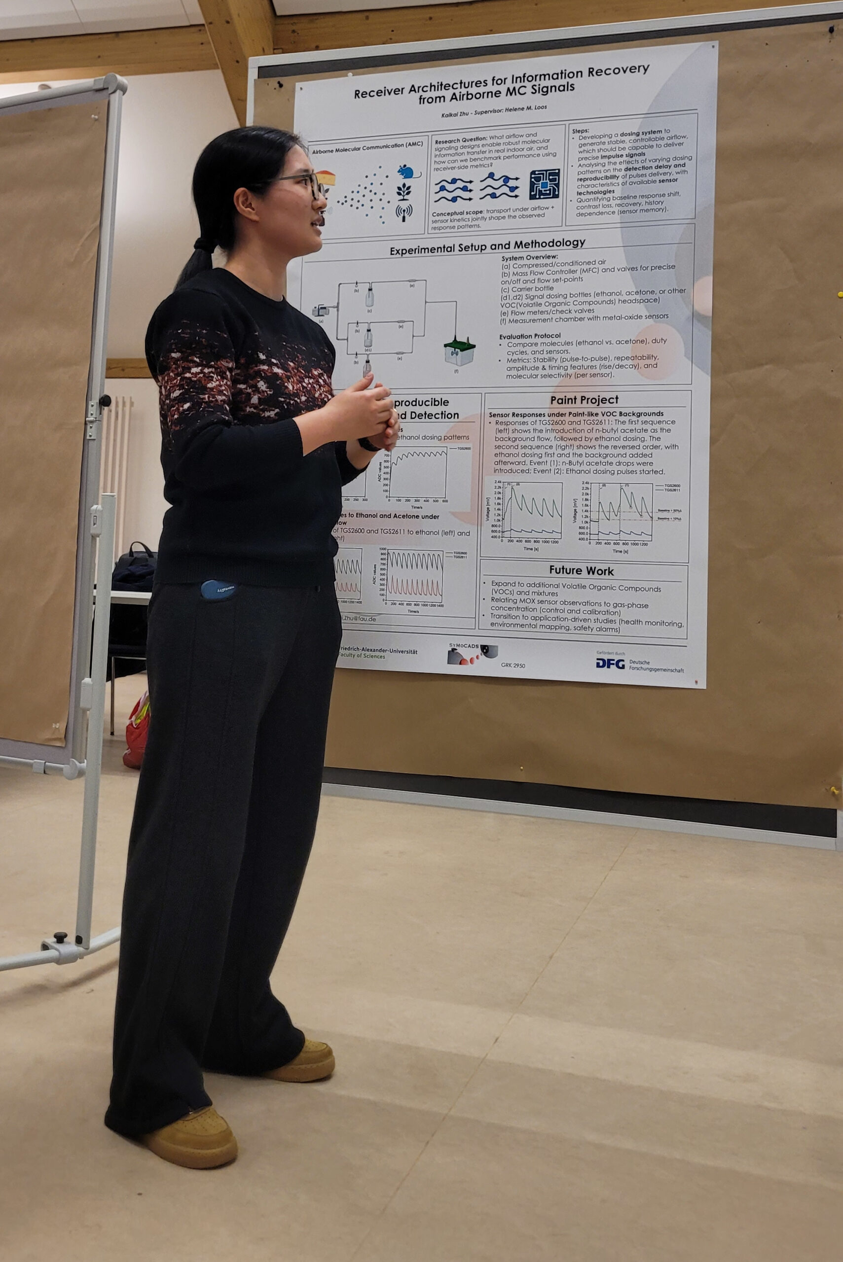 Kakai Zhu (female) during the flash talk at the poster session