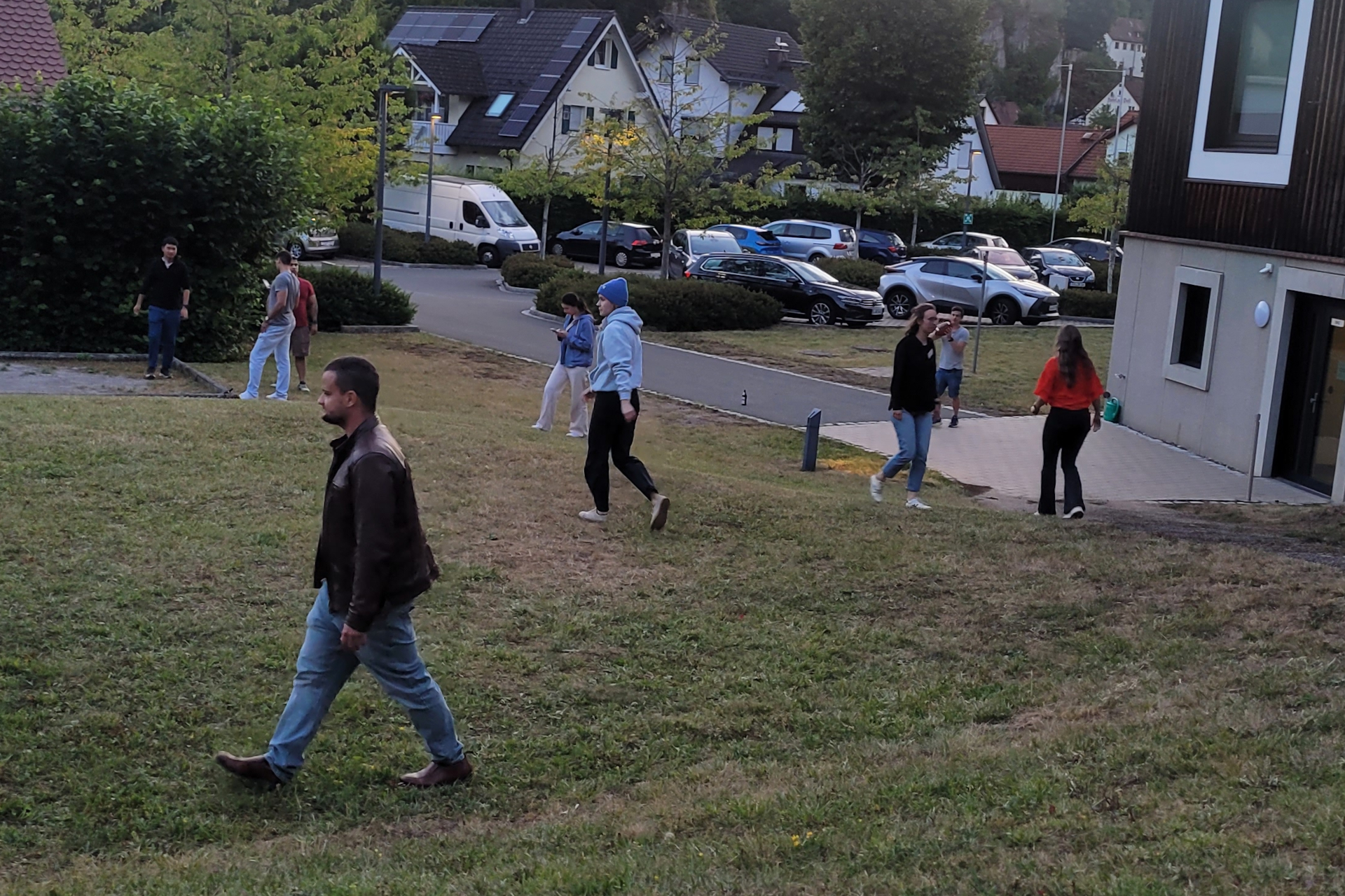 A group of people male and female playing rugby